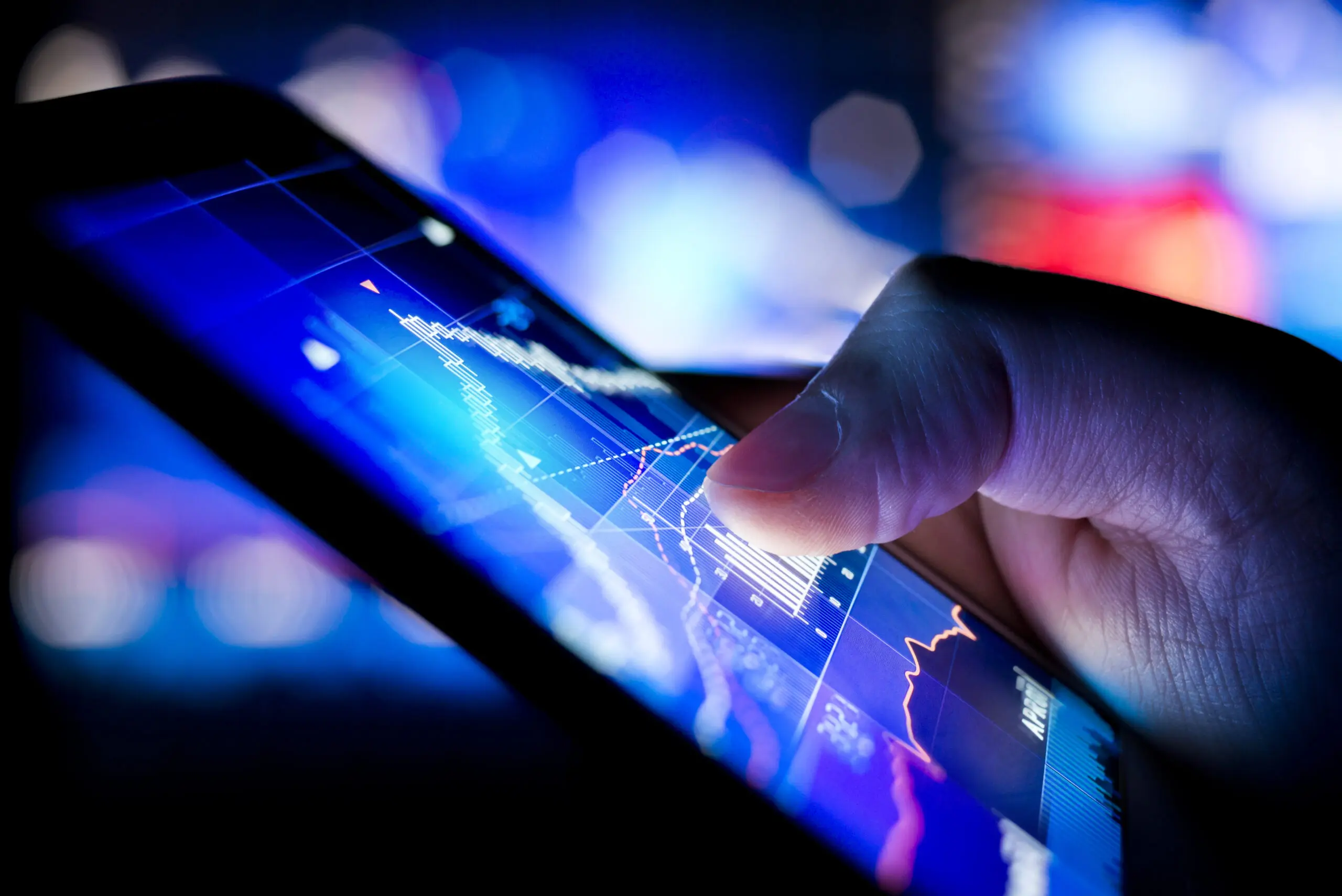 A,Person,Checking,Stock,Market,Data,On,A,Mobile,Device.